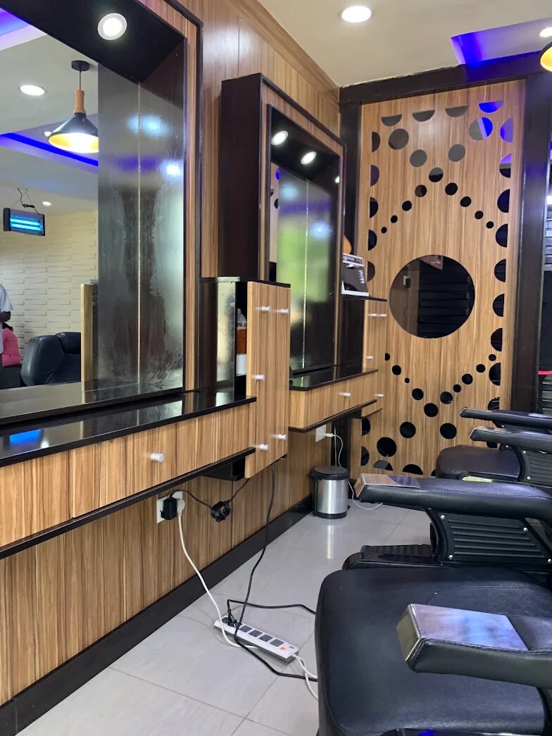 Barber stations with mirrors, oak panels and a cut-out wooden screen